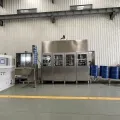 Llenadora automática de tambores (Alineación fotoeléctrica y visión artificial)
